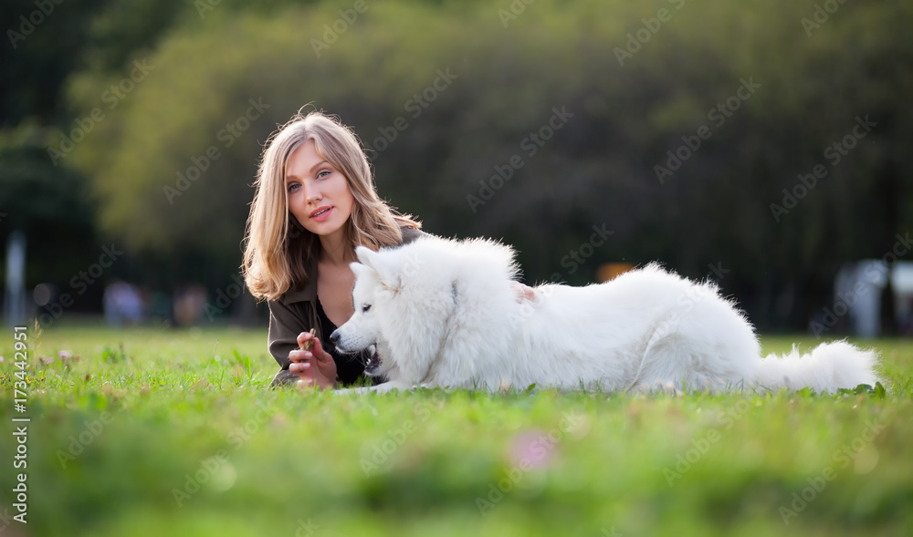 Pretty girl with dog on grass Pretty girl with dog on grass