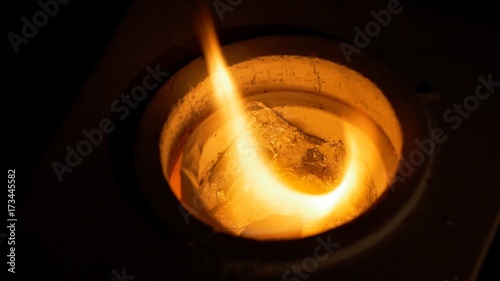 Iron lingot on 1000 C temperature in furnace. Inside a furnace photo