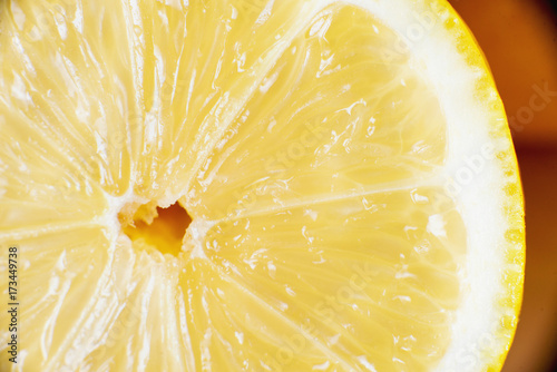 macro, fresh and ripe yellow lemon in a cut