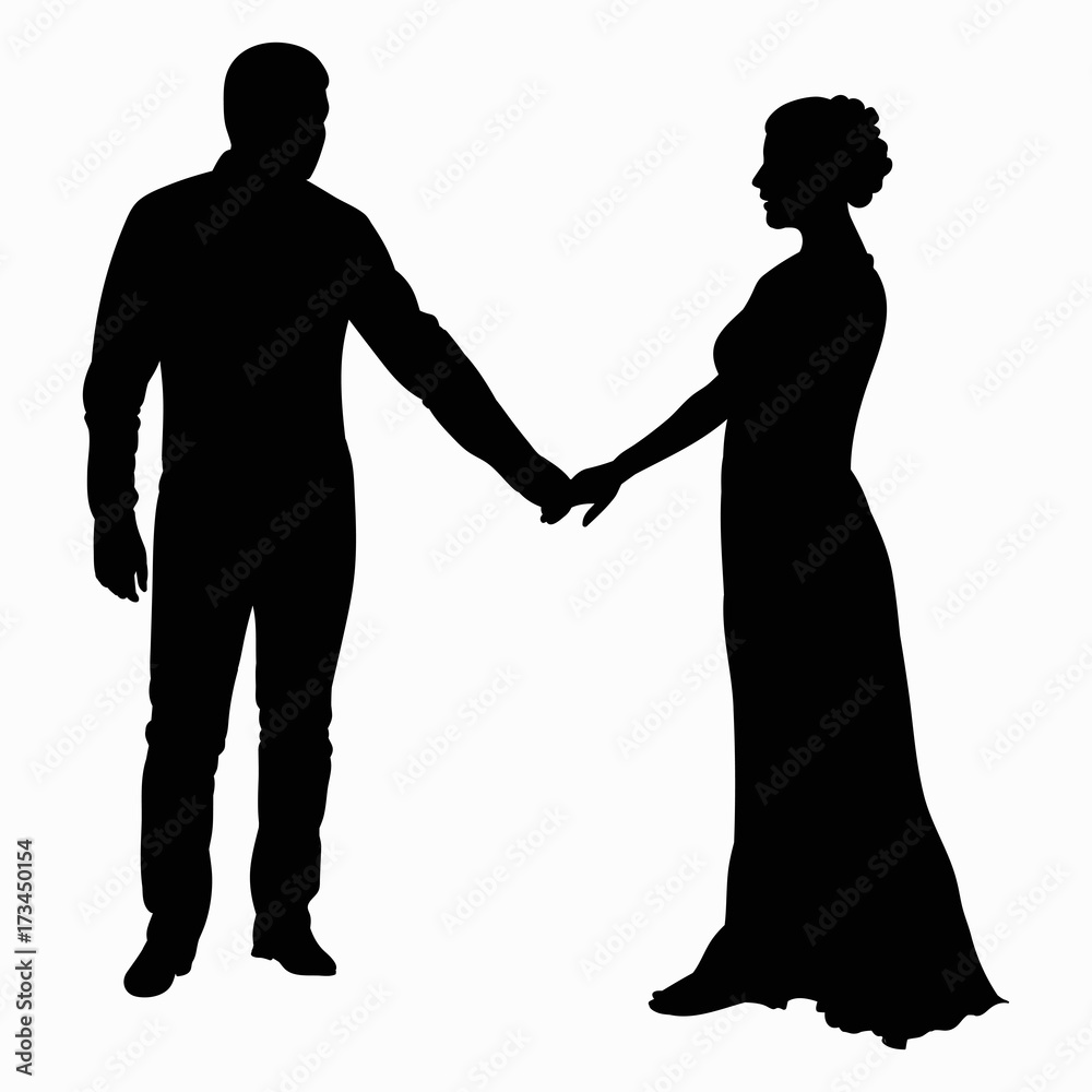 Silhouette of a young guy and a girl in a long dress holding hands