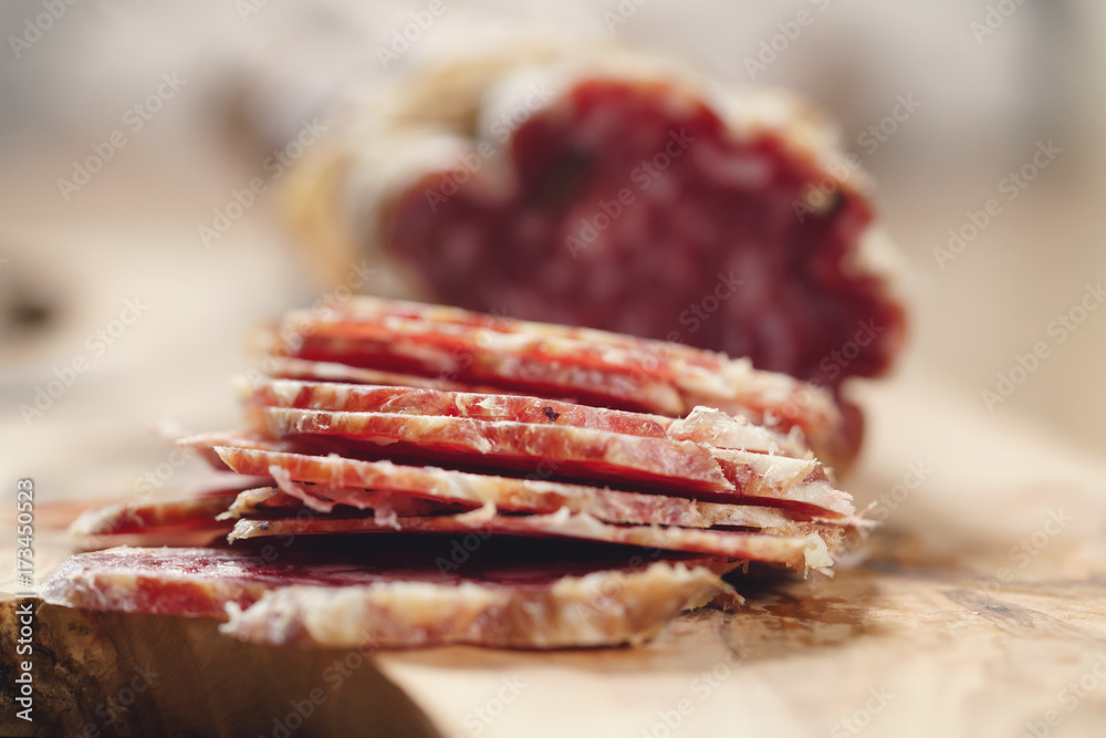 Obraz premium sliced italian salame close up shot