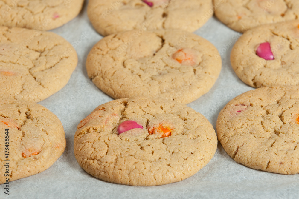 Homebaked Chewable Butter Biscuits With Colored Chocolate Sweets. Homebaked Chewable Butter Biscuits With Colored Chocolate Sweets.
