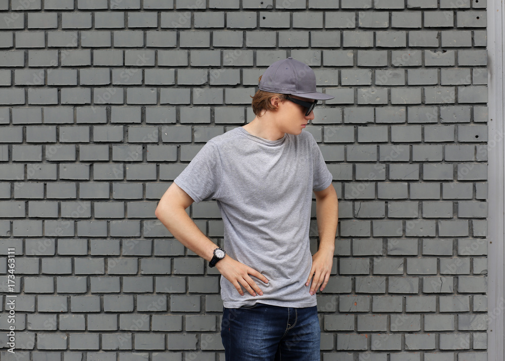 Attractive teenage boy in urban background Attractive teenage boy in urban background