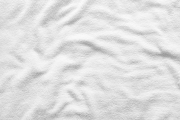 White towel texture for background. That fabric or textile consist of cotton fiber material. Look plush, fluffy, dry, soft and clean. For background about baby, spa, hotel, laundry and hygiene etc.