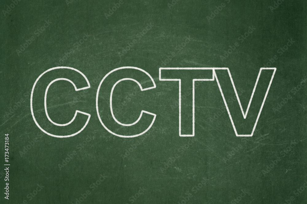 Security concept: CCTV on chalkboard background Security concept: CCTV on chalkboard background