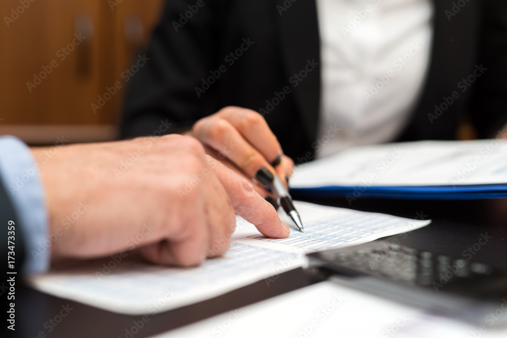Detail of a writing businesswoman hand Detail of a writing businesswoman hand