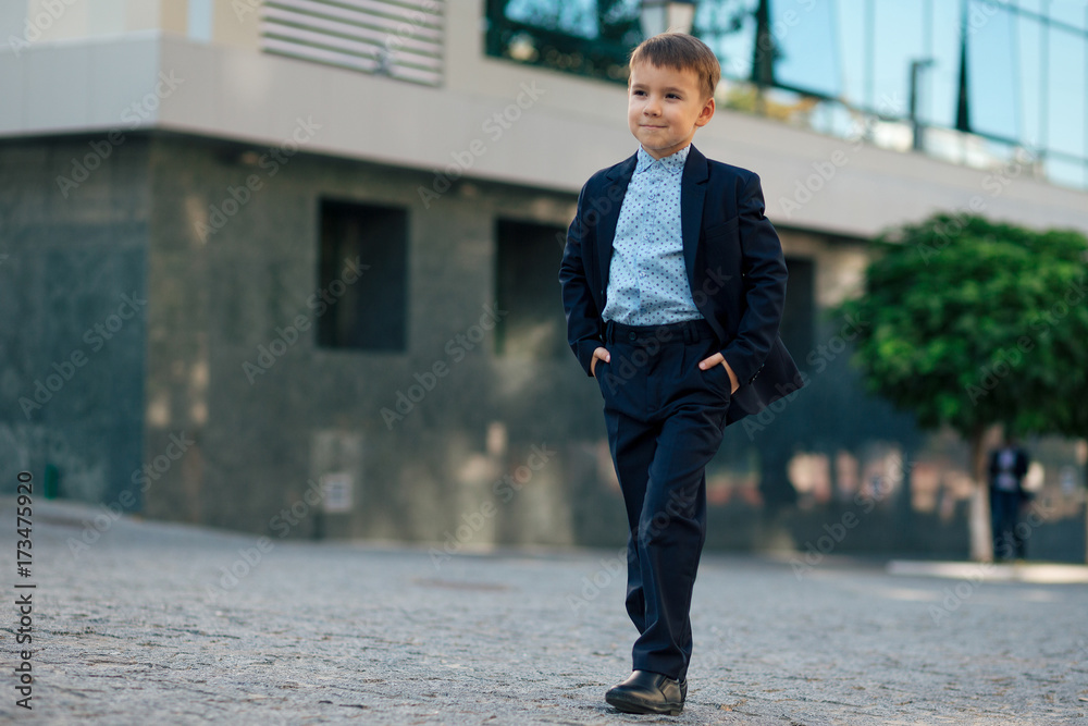 Boy in classic modern dark blue business costume Boy in classic modern dark blue business costume