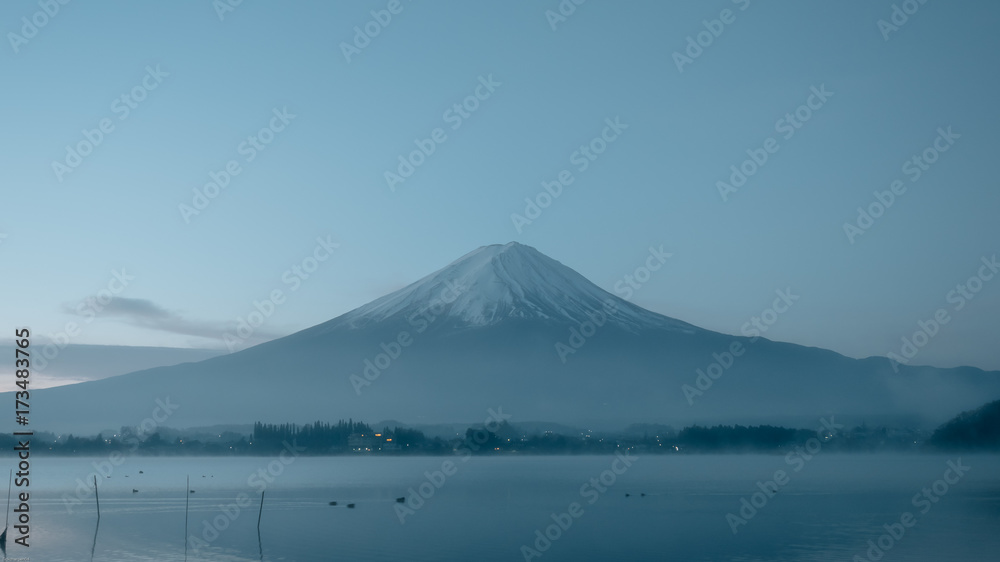 beauty night landscape view from kawaguchi lake with sky and fuji mountain range background with motion blur from group of duck  from japan