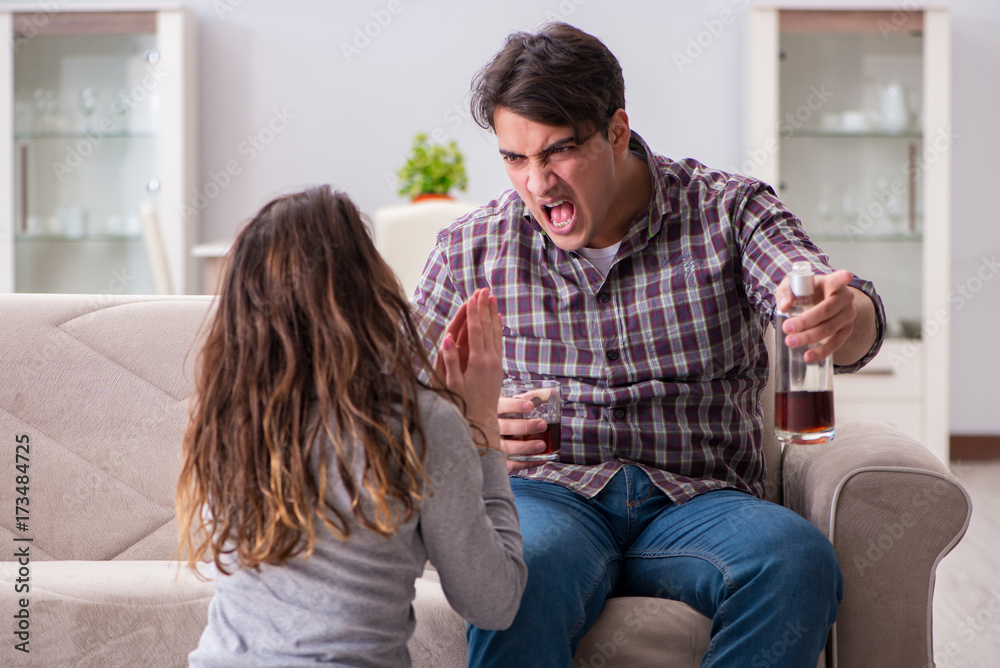 Domestic violence concept in a family argument with drunk alcoho Domestic violence concept in a family argument with drunk alcoho