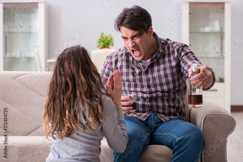 Domestic violence concept in a family argument with drunk alcoho