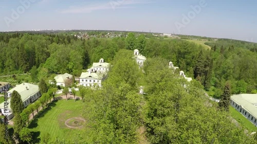 Flying over a manse with green outdoor space and treeline path. Scene of Tsaritsyno museum and reserve in Moscow