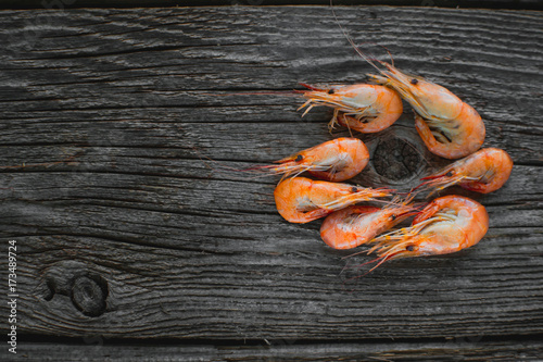 On a wooden table beautifully arranged shrimp