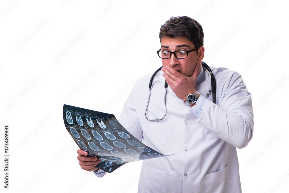 Young male doctor holding a radiograph isolated on white backgro Young male doctor holding a radiograph isolated on white backgro