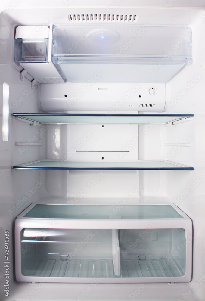 Inside the empty white refrigerator with shelves for where to place bottles of water, fruit , food , Inside the empty white refrigerator with shelves for where to place bottles of water, fruit , food ,