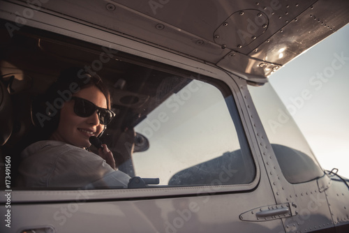 Woman-pilot in aircraft