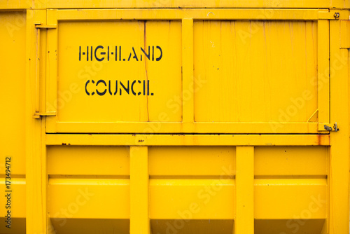 Yellow container with black stencil mark