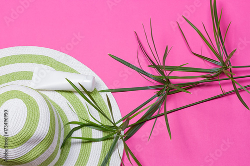 Beach hat and coconut leaves