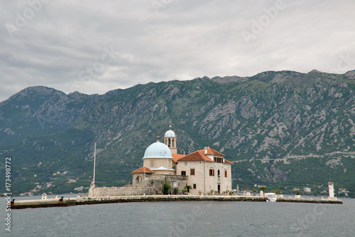 Arrival to the famous Our lady of the reef Island and Church in Kotor Bay of Montenegro
