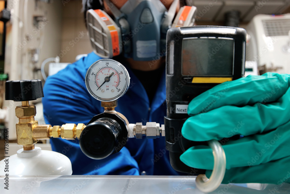 Instrument technician is take standard gas for the job calibrate or function check of personal gas tester or gas detector. Instrument technician is take standard gas for the job calibrate or function check of personal gas tester or gas detector.
