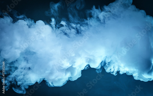 Cloud of vapor. dark blue background photo