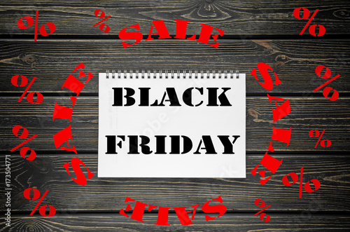 Black Friday sales Advertising Poster on Black Wooden background