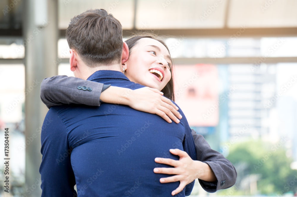 Couple man and woman hug in city outdoor Couple man and woman hug in city outdoor