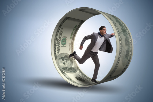 Businessman in hamster wheel chasing dollars