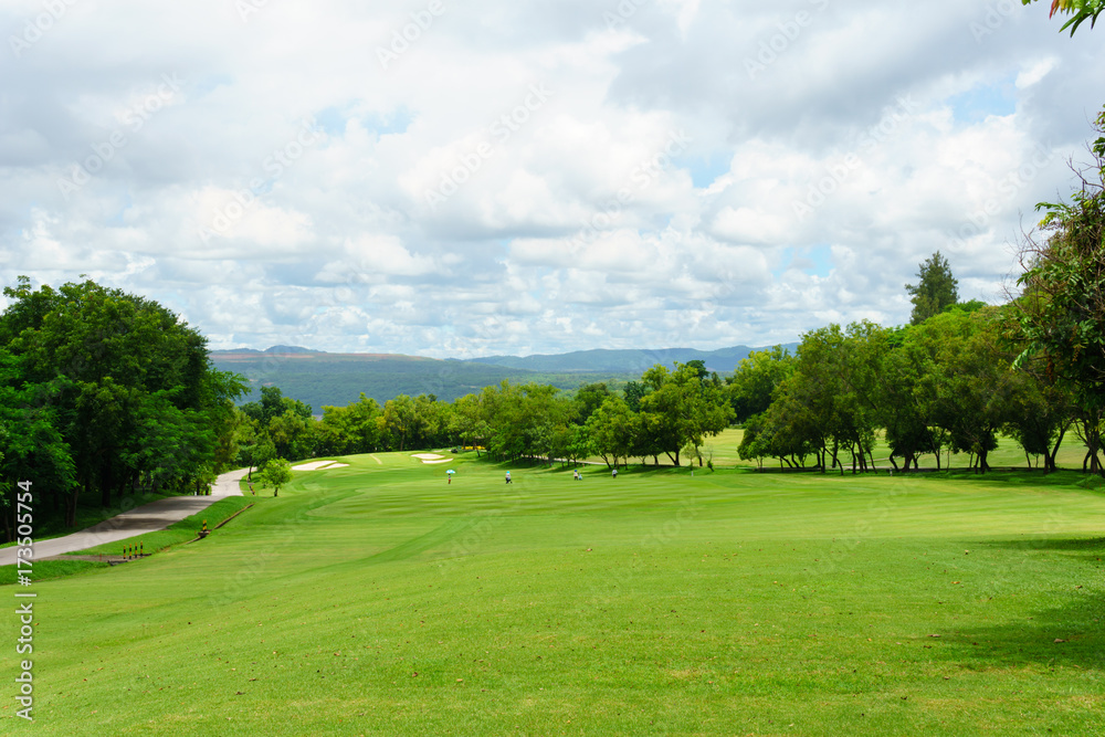 golf course with mountain and blue sky and cloud background