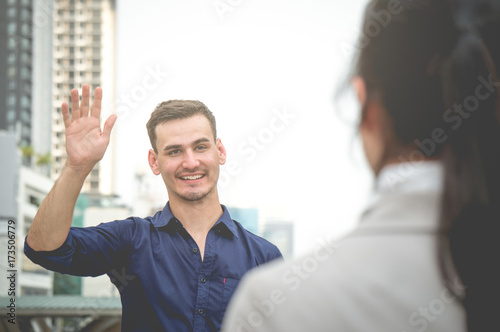 Businessman greet and say hello freind colleague in city outdoor
