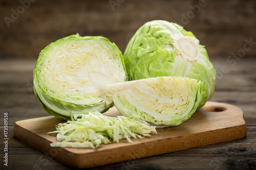 Fototapeta Fresh cabbage on the wooden table