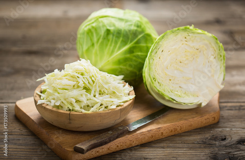 Vászonkép Fresh cabbage on the wooden table