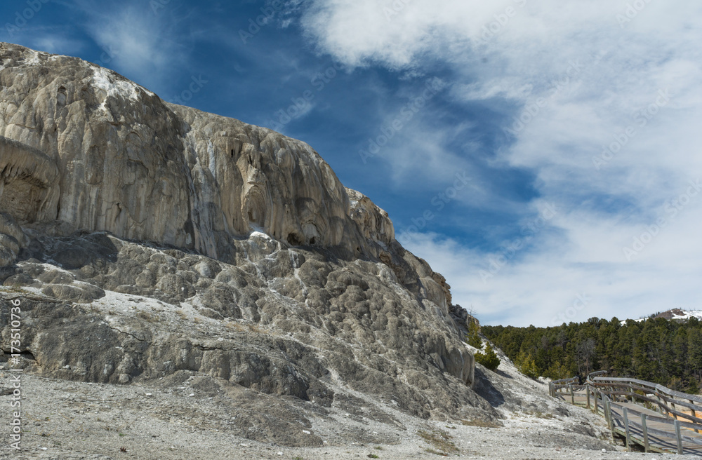 Mineral rock cliff with walkway at Mammoth Hot Springs