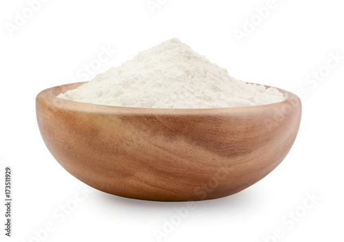 Flour in a wooden bowl isolated