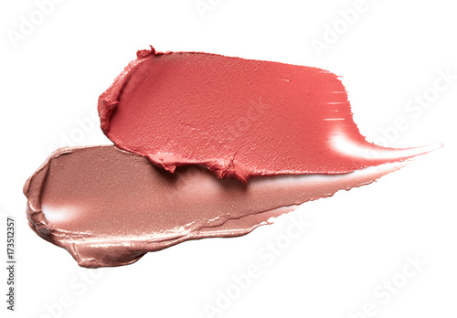 Smudged lipsticks isolated on white background photo