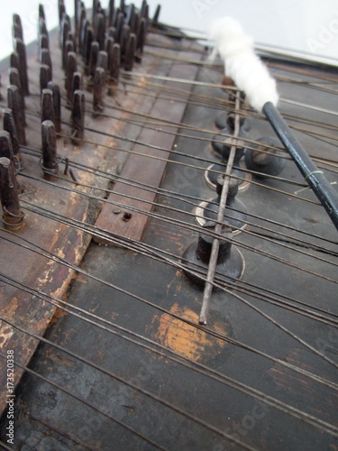 close up on details of an old traditional wood dulcimer photo