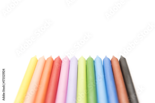 Group of colored crayons on white background top view
