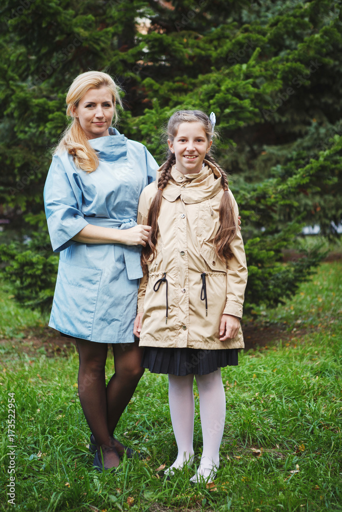 Fototapeta premium Mom with her daughter during autumn