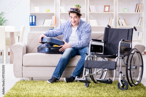 Young disabled man preparing for summer vacation © Elnur