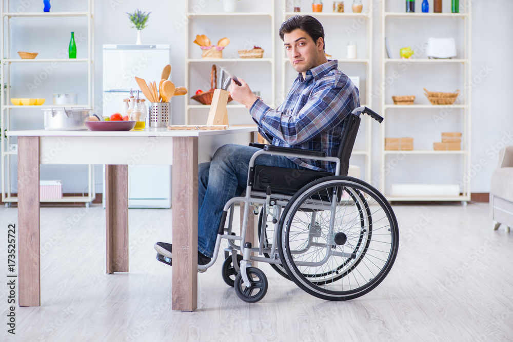 Disabled young man husband working in kitchen Disabled young man husband working in kitchen