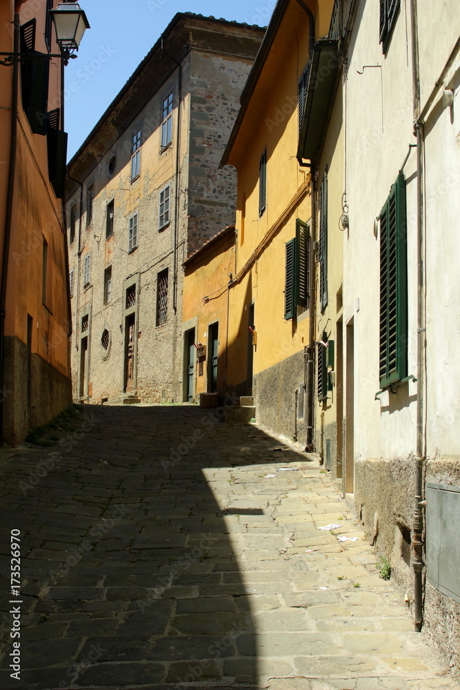 The city of Pistoia in Tuscany, Italy.  Narrow alley in the old town