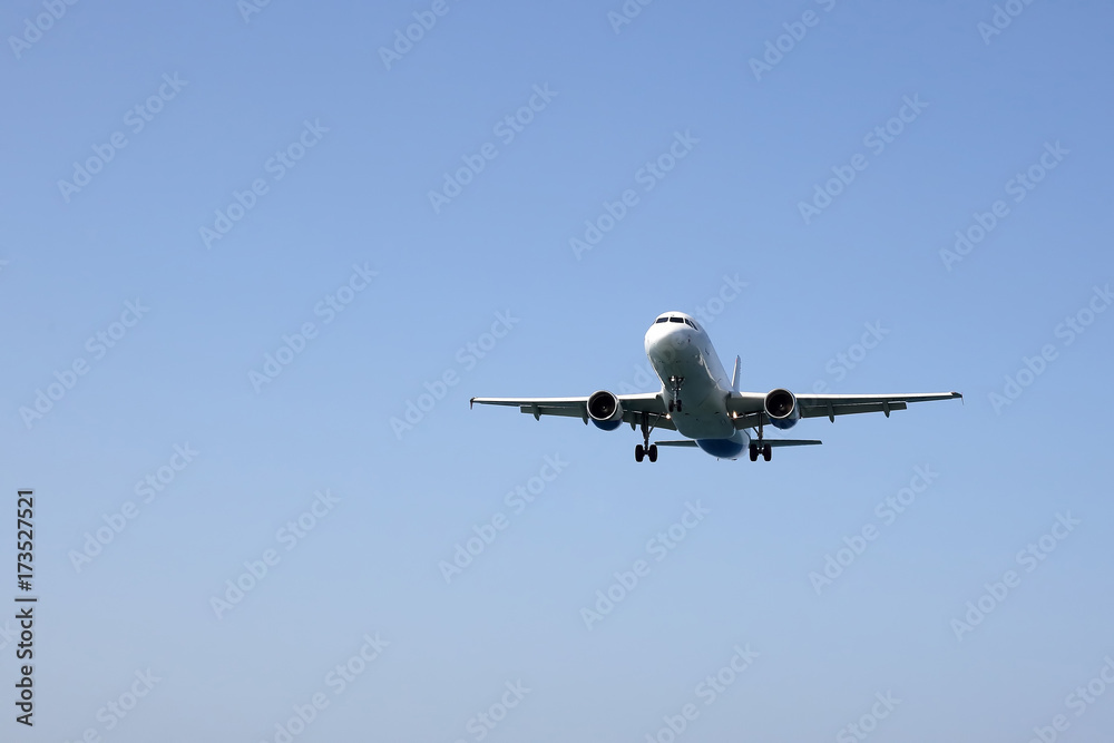 passenger jet flies in for a landing passenger jet flies in for a landing