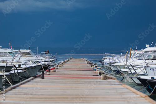 A thunderstorm pulls on Krk. View over a footbridge.