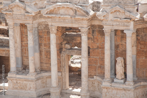 Columns and statues in ancient amphitheater in Hierapolis, Turkey