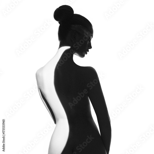 Gorgeous young lady with shadow on her body