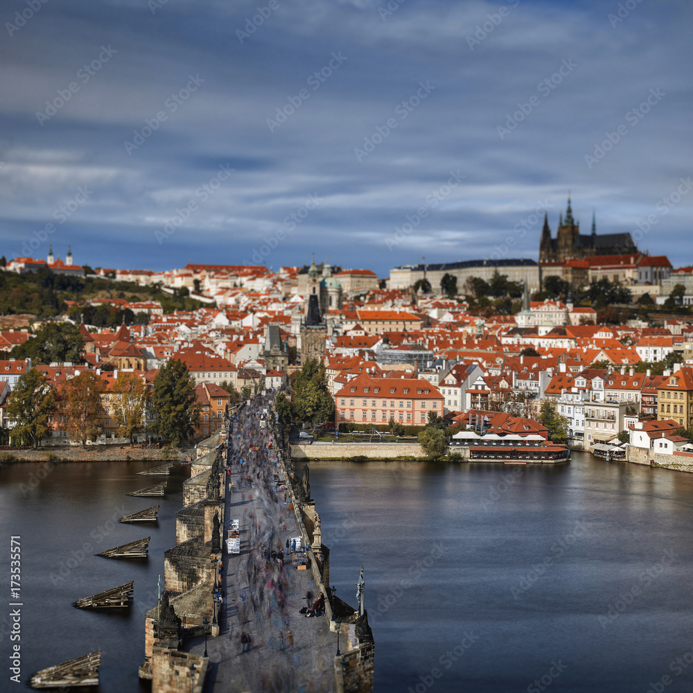 Pargue , wiew of the Lesser Bridge Tower of Charles Bridge (Karluv Most) and Prague Castle, Czech Republic. Tourists on Charles bridge