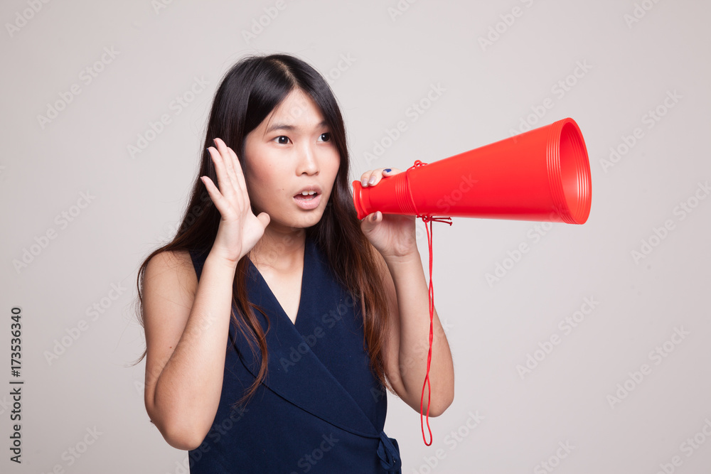 Beautiful young Asian woman announce with megaphone. Beautiful young Asian woman announce with megaphone.