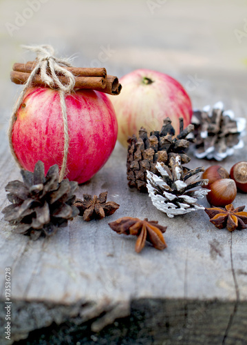 dessert  apple with cinnamon and nuts  Christmas decor and food on a wooden table