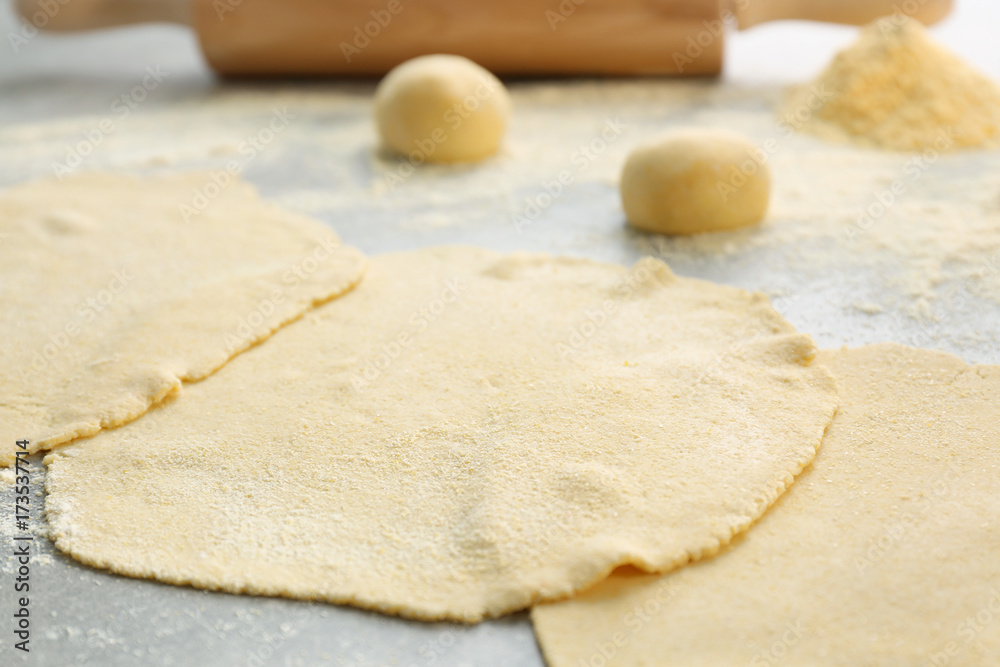 Rolled dough for tortillas on kitchen table Rolled dough for tortillas on kitchen table