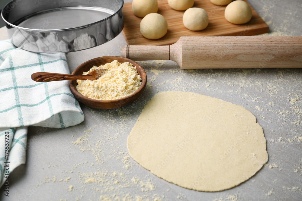 Rolled dough for tortilla on kitchen table Rolled dough for tortilla on kitchen table