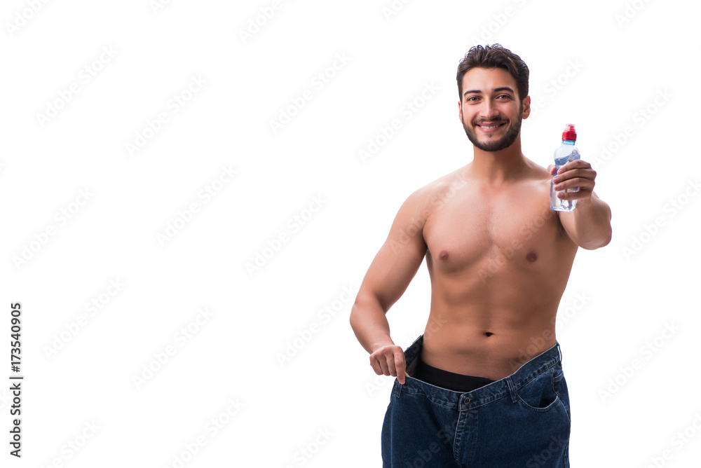 Man in dieting concept with oversized jeans Man in dieting concept with oversized jeans